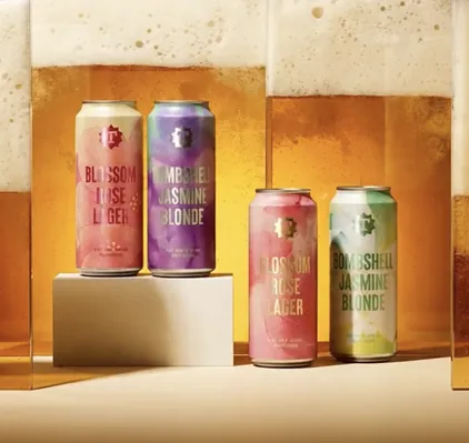Craft beer can lineup including Bombshell Jasmine Blonde and Blossom Rose Lager, packaging design by Renuvo Design Inc.