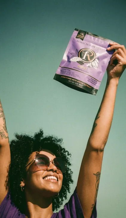 Model celebrating while holding a purple Ross Chocolates pack, lifestyle campaign by Renuvo Design Inc.